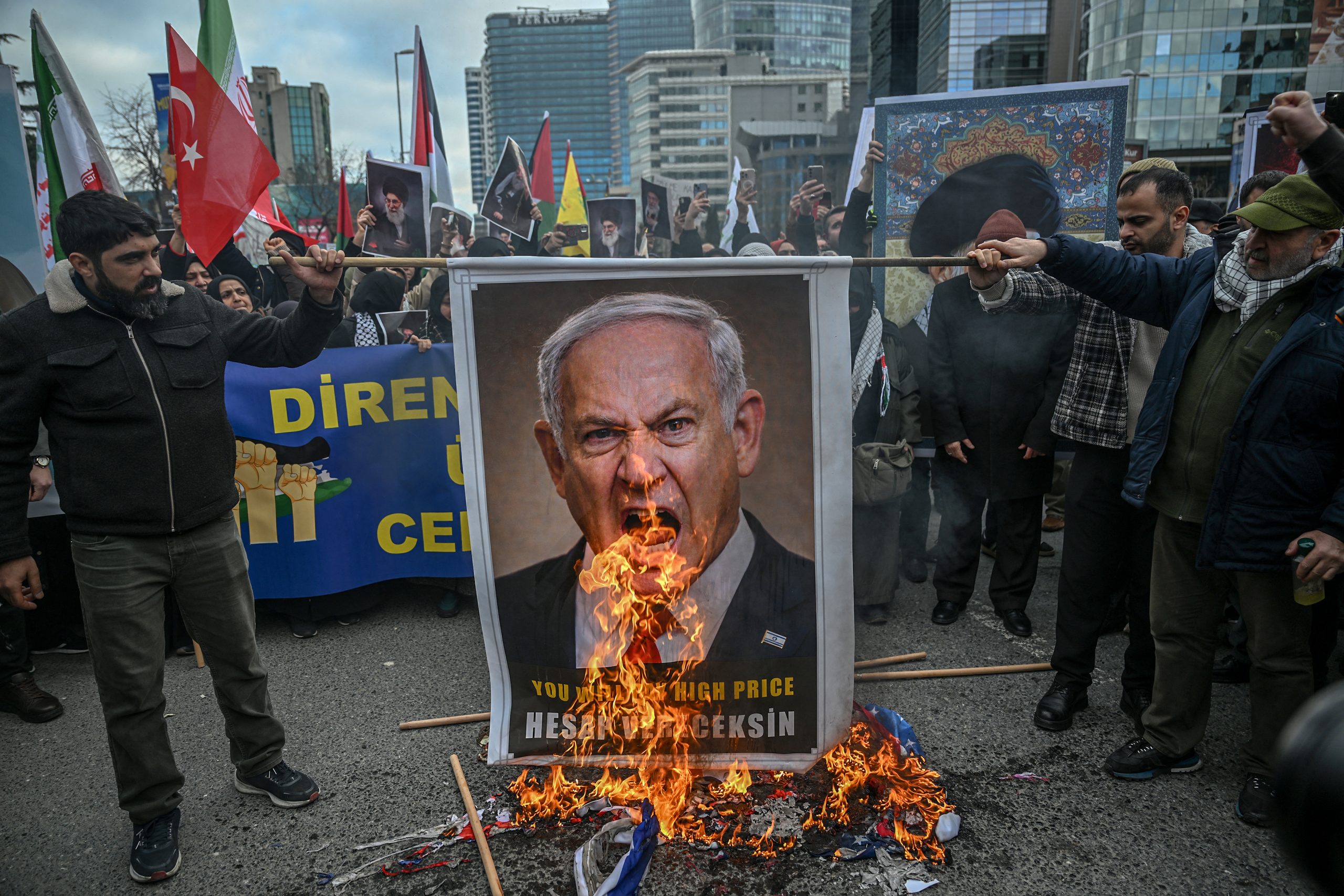 Protestors set fire to an image depicting Israeli Prime Minister Benjamin Netanyahu as they gather to protest against the US and Israel attack of Iran and the killing of the Supreme leader in front of Israel Consulate in Istanbul on March 1, 2026. The United States and Israel launched strikes against Iran on February 28, 2026 sparking fears of regional war with explosions reported across the Middle East as the Islamic republic retaliated with barrages of missiles. (Photo by Ozan KOSE / AFP)