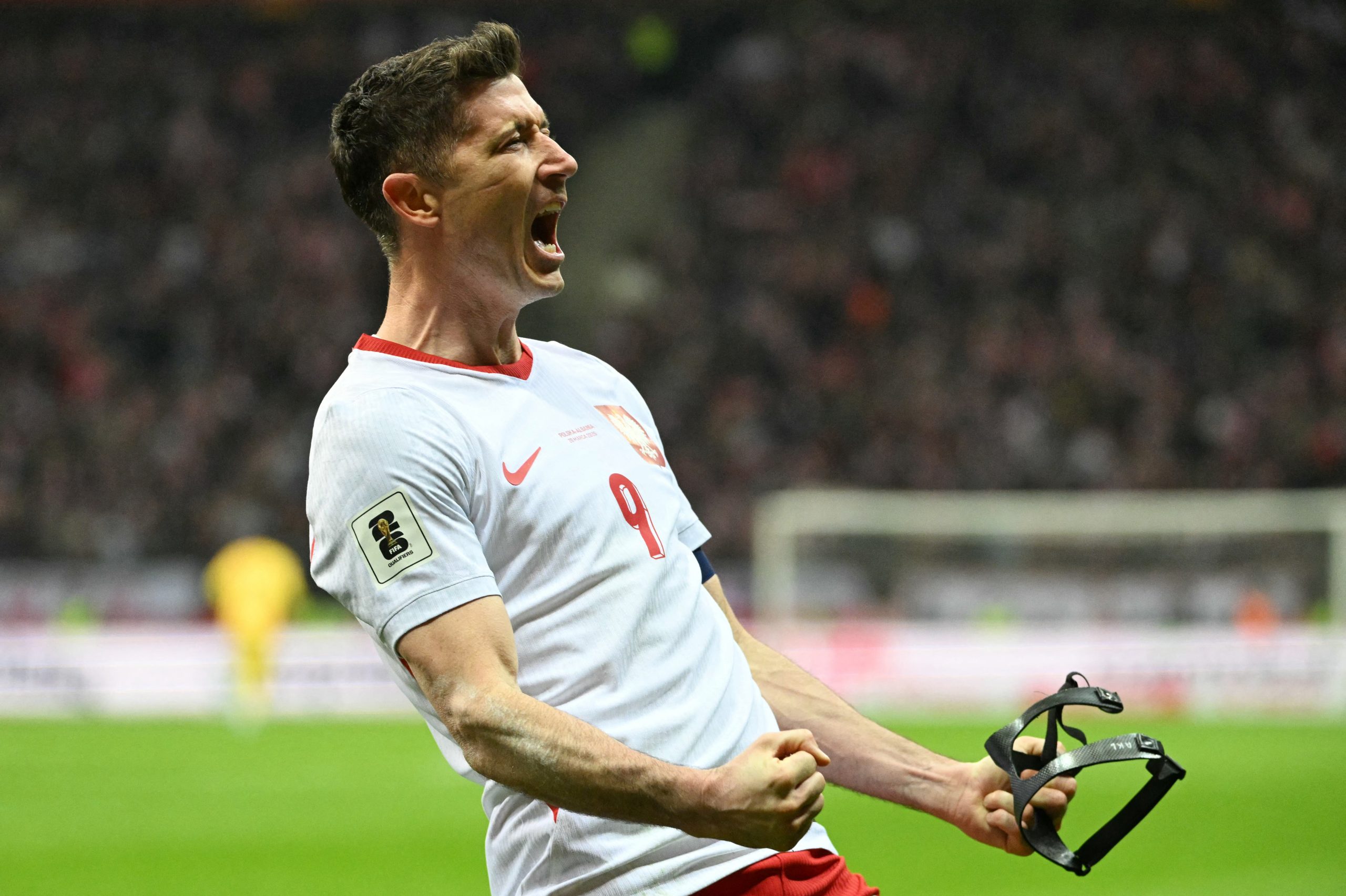 Poland's forward #09 Robert Lewandowski celebrates scoring his team's first goal during the play-off FIFA World Cup 2026 European qualification semi-final football match between Poland and Albania in Warsaw on March 26, 2026. (Photo by Sergei GAPON / AFP)