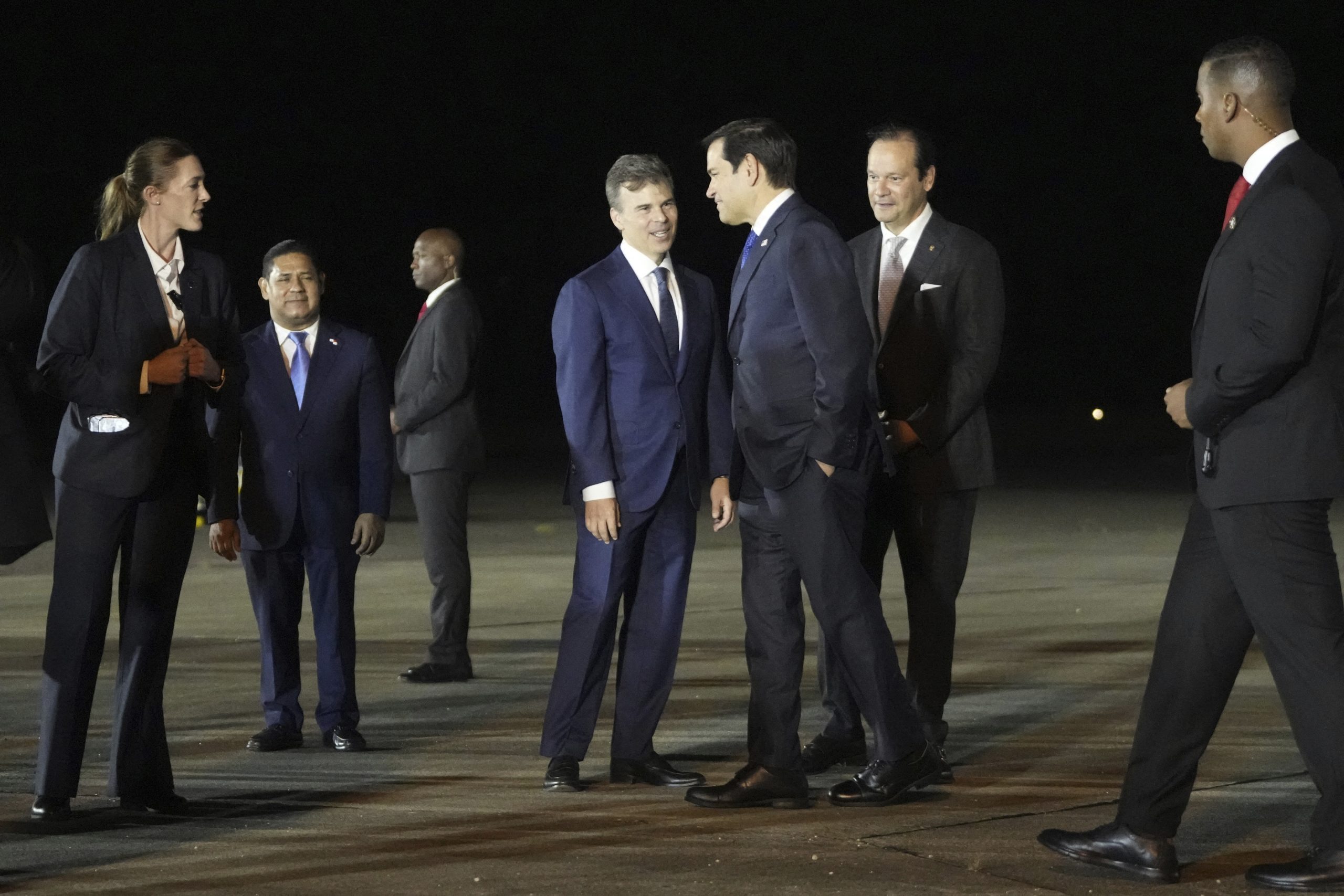 US Secretary of State Marco Rubio (3rd-R) greets Panamanian Foreign Minister Javier Martínez-Acha (2nd-R) and John Barrett, Chargé d'affaires (4th-R), as he arrives at the international airport in Panama Pacifico in Panama city on February 1, 2025. Marco Rubio arrived Saturday in the Panamanian capital on his first trip abroad as head of U.S. diplomacy, amid tensions over President Donald Trump's threat to retake control of the Panama Canal. (Photo by Mark Schiefelbein / POOL / AFP)