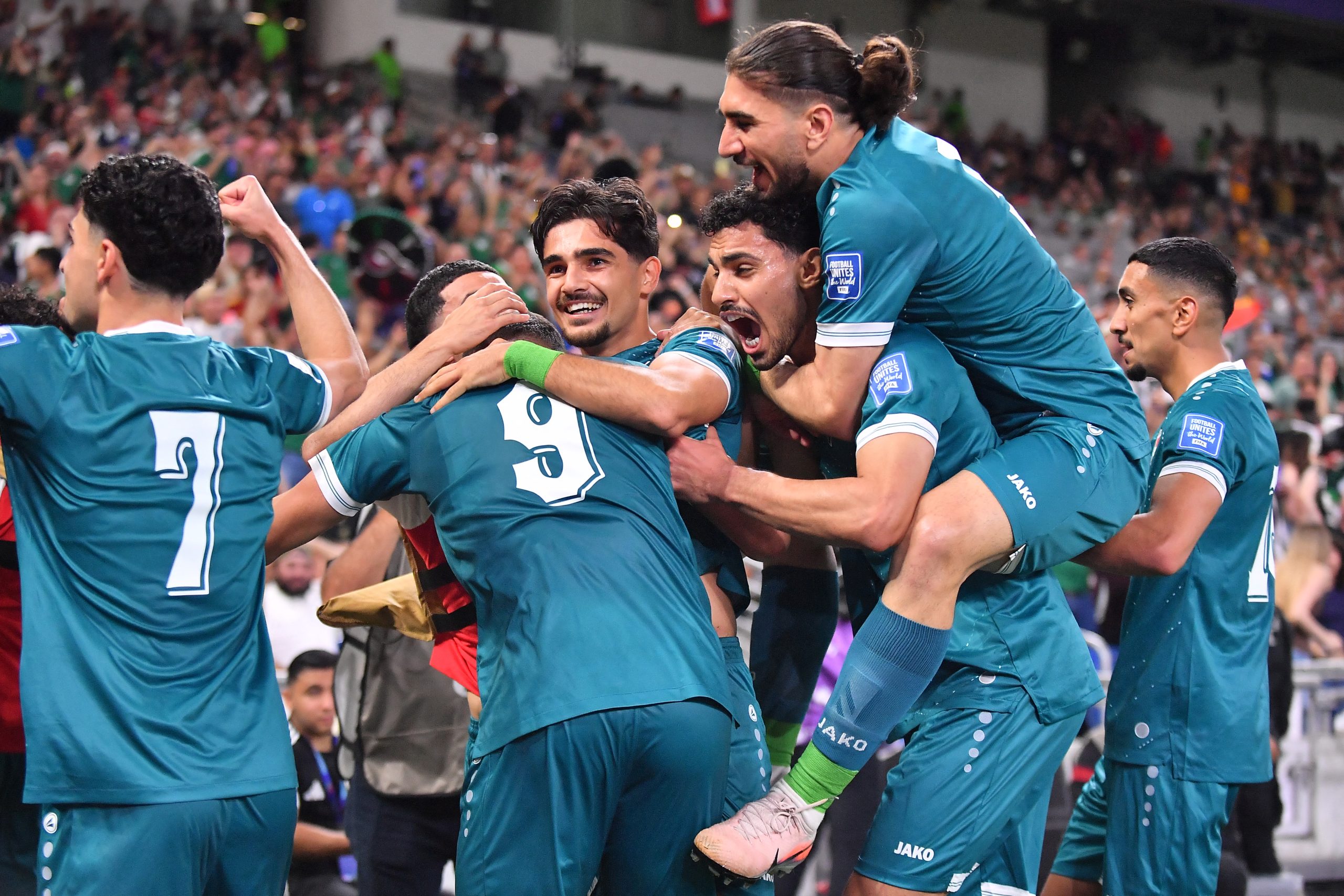 GUADALUPE, MEXICO - MARCH 31: Ali Ibrahim Al-Hamadi of Irak celebrates with teammates after scoring his team's first goal during the FIFA World Cup 2026 Play-Off tournament final match between Irak and Bolivia at Estadio Monterrey on March 31, 2026 in Guadalupe, Mexico.   Azael Rodriguez/Getty Images/AFP (Photo by Azael Rodriguez / GETTY IMAGES NORTH AMERICA / Getty Images via AFP)