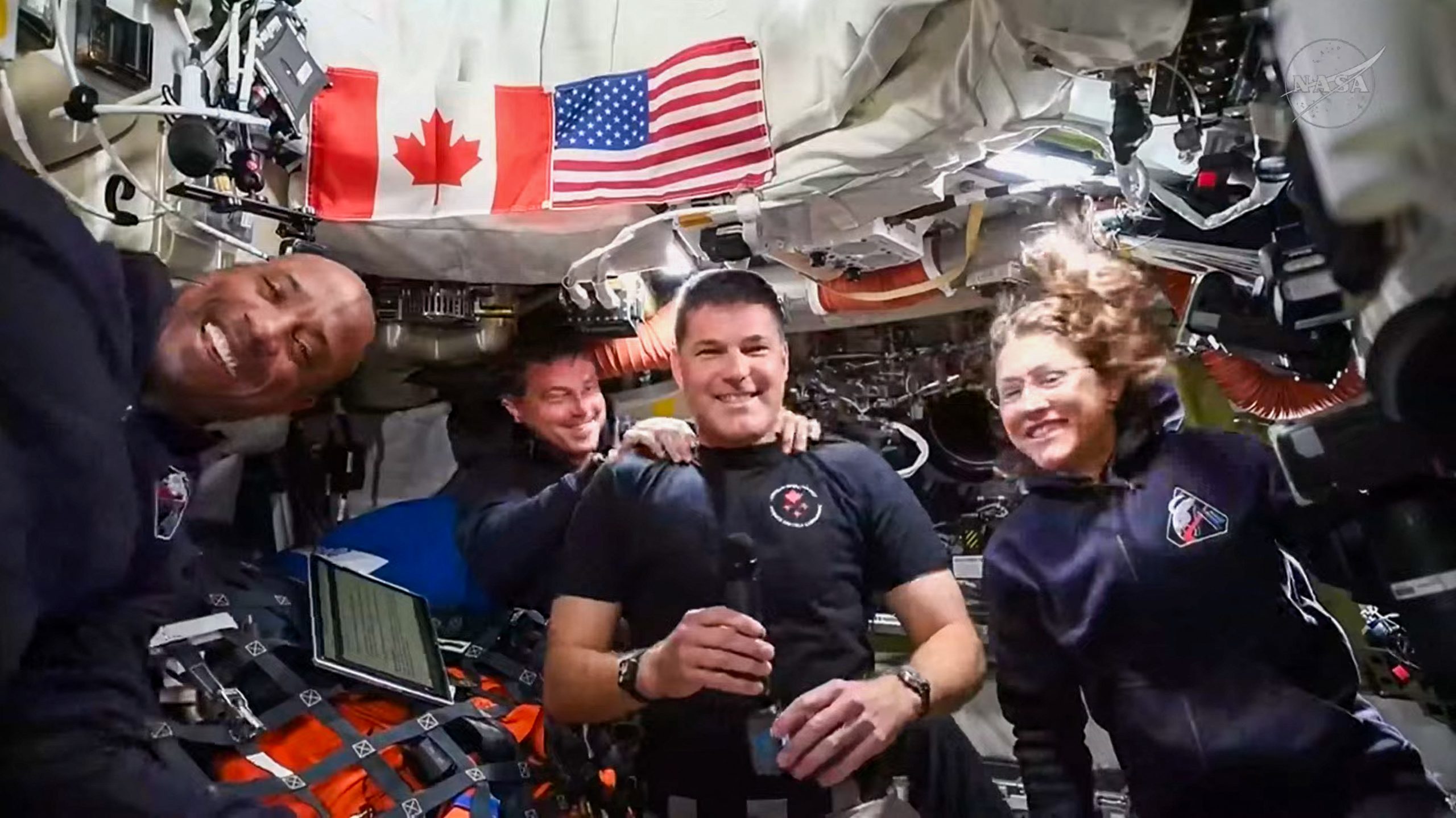 This screengrab taken from a NASA livestream shows Artemis II mission astronauts (L-R) NASA's pilot Victor Glover, NASA's commander Reid Wiseman, Canadian Space Agency's mission specialist Jeremy Hansen and NASA's mission specialist Christina Koch as they attend a "VIP call" with Canadian children from inside the Orion spacecraft while on their way to the Moon on April 4, 2026. The four astronauts for the Artemis II mission were gearing up April 4 for their long-anticipated lunar flyby, including reviewing the surface features they must analyze and photograph during their time circling the Moon. (Photo by Handout / NASA / AFP) / RESTRICTED TO EDITORIAL USE - MANDATORY CREDIT "AFP PHOTO / NASA" - HANDOUT - NO MARKETING NO ADVERTISING CAMPAIGNS - DISTRIBUTED AS A SERVICE TO CLIENTS