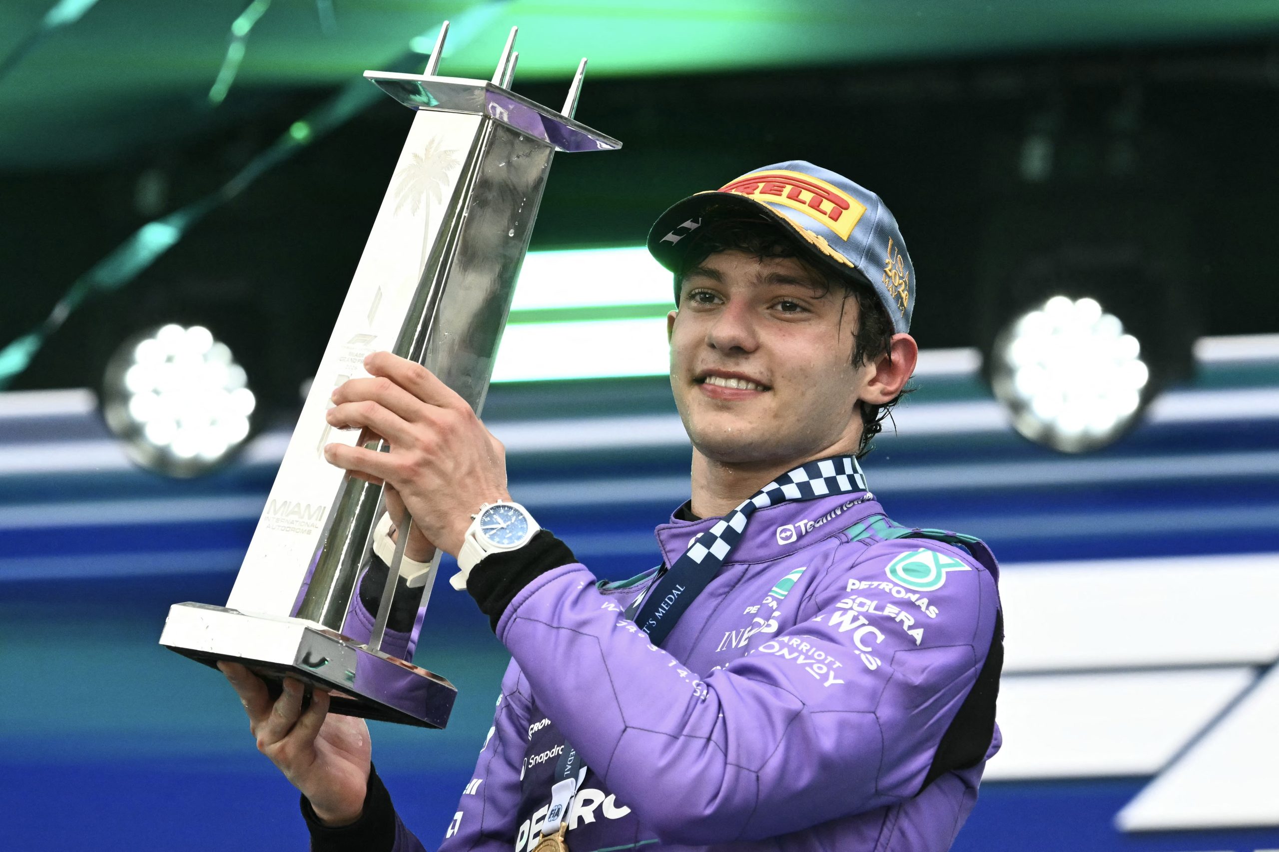 Race winner Mercedes' Italian driver Kimi Antonelli holds the trophy as he celebrates on the podium after the 2026 Miami Formula One Grand Prix at Miami International Autodrome in Miami Gardens, Florida, on May 3, 2026. (Photo by CHANDAN KHANNA / AFP)