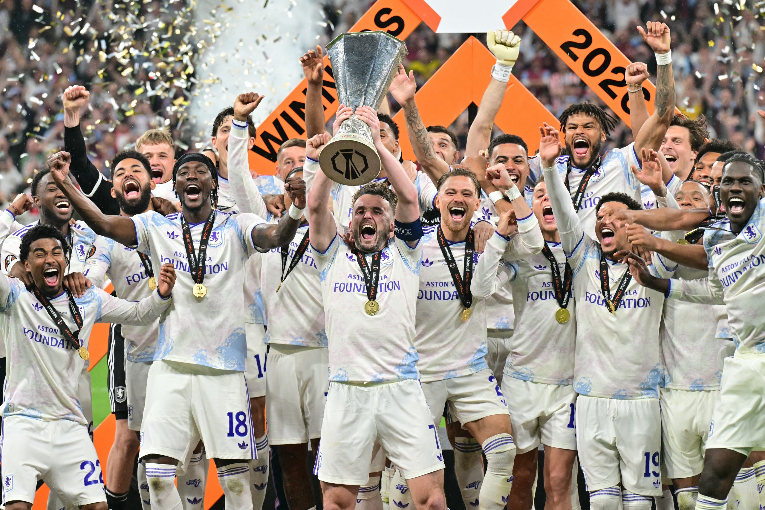 Aston Villa's Scottish midfielder #07 John McGinn and his teammates celebrate with the trophy after winning the UEFA Europa League final football match between SC Freiburg and Aston Villa at Besiktas Park in Istanbul on May 20, 2026. (Photo by Stefano RELLANDINI / AFP)