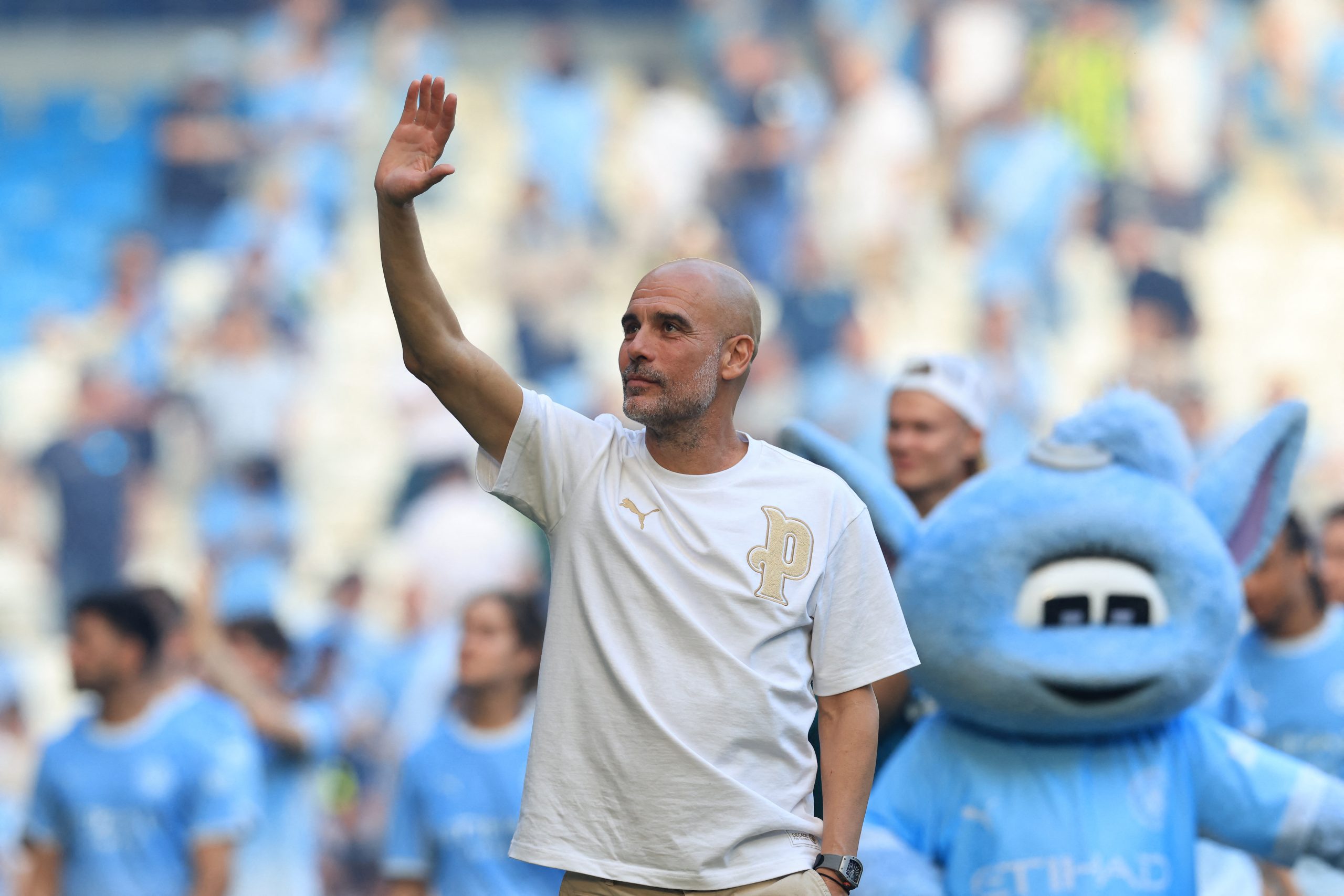 Manchester City's Spanish manager Pep Guardiola waves as he takes a lap of honour at the end of the English Premier League football match between Manchester City and Aston Villa at the Etihad Stadium in Manchester, north west England, on May 24, 2026. (Photo by Darren Staples / AFP) / RESTRICTED TO EDITORIAL USE. No use with unauthorized audio, video, data, fixture lists, club/league logos or 'live' services. Online in-match use limited to 120 images. An additional 40 images may be used in extra time. No video emulation. Social media in-match use limited to 120 images. An additional 40 images may be used in extra time. No use in betting publications, games or single club/league/player publications. /