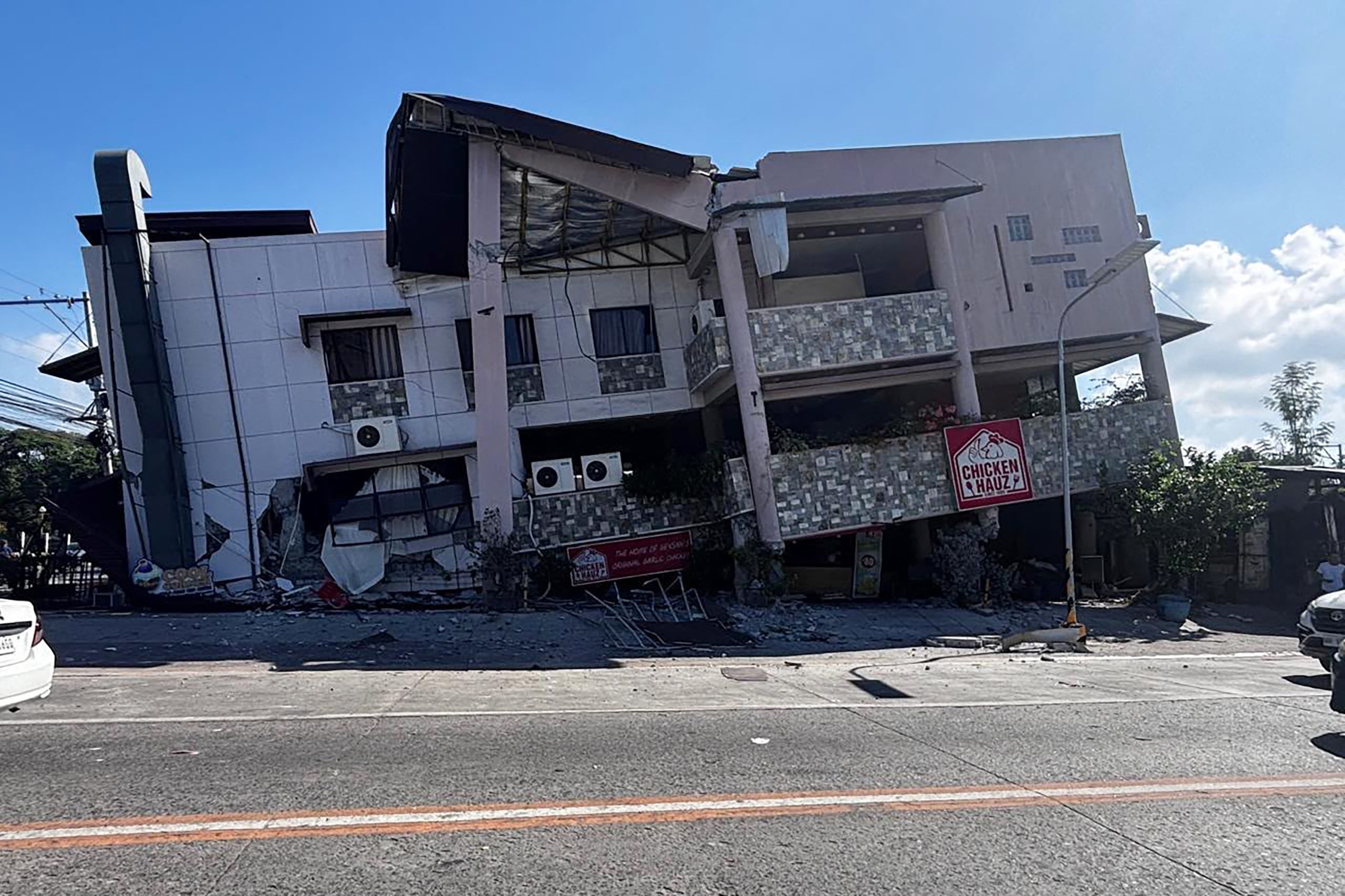 A collapsed building is seen after an 7.8 magnitude earthquake in General Santos City on June 8, 2026. A 7.8-magnitude earthquake that struck the southern Philippines on June 8 killed at least one person and collapsed buildings, police said, as the disaster sparked tsunami warnings across the region. (Photo by Edwin Espejo / AFP)