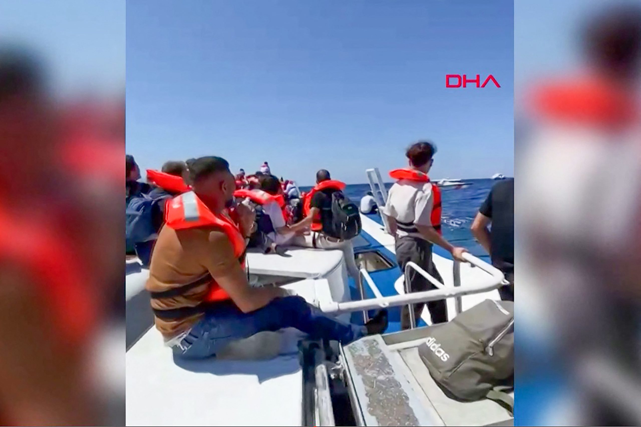 This screen grab image taken from UGC handout video courtesy of DHA on August 30, 2026, shows passengers waiting to be rescued at sea following the sinking of the ferry they were traveling on after it left the port of Kyrenia in the self-proclaimed Turkish Republic of Northern Cyprus (TRNC), recognised only by Turkey, in the north of the divided Mediterranean island of Cyprus. A passenger ferry carrying 267 people capsized and sank off Northern Cyprus on August 30, killing at least seven people and leaving 23 missing, officials said, as a rescue operation was under way. The vessel capsized 6.5 kilometres (four miles) off the coast of Cyprus, shortly after it had left a Northern Cyprus port heading to Turkey's mainland. (Photo by DHA (Demiroren News Agency) / AFP) / Turkey OUT / XGTY / RESTRICTED TO EDITORIAL USE - MANDATORY CREDIT "AFP PHOTO /DHA / UGC - NO MARKETING NO ADVERTISING CAMPAIGNS - DISTRIBUTED AS A SERVICE TO CLIENTS / AL JAZEERA MEDIA NETWORK OUT